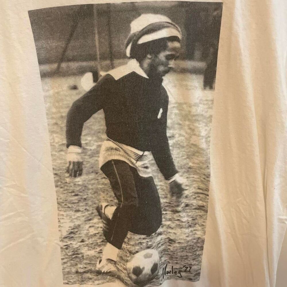 Zion-rootswear t-shirt with Bob Marley playing soccer